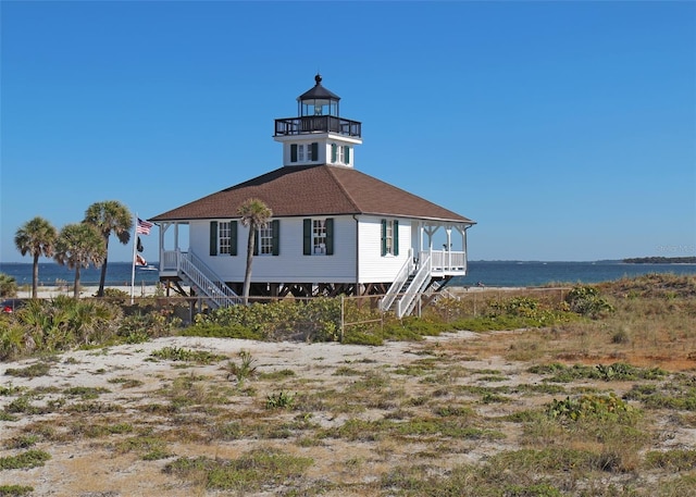 exterior space with a water view