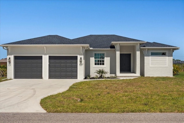 view of front of home featuring a garage and a front yard