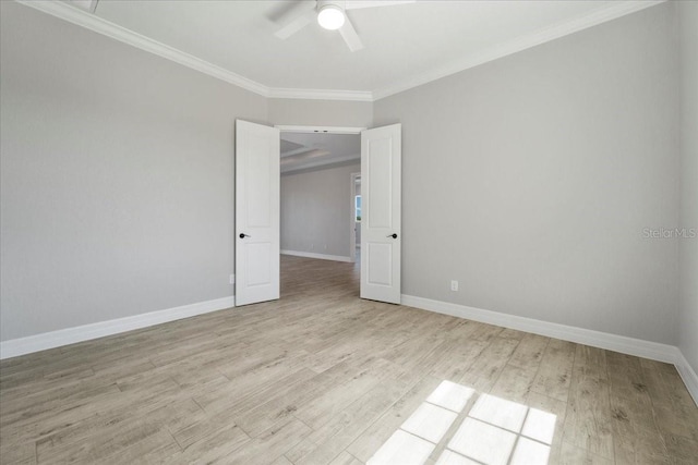 empty room with ceiling fan, ornamental molding, and light hardwood / wood-style flooring