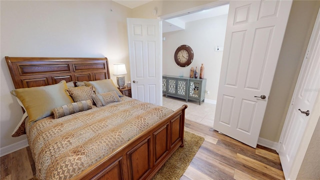 bedroom with light hardwood / wood-style floors