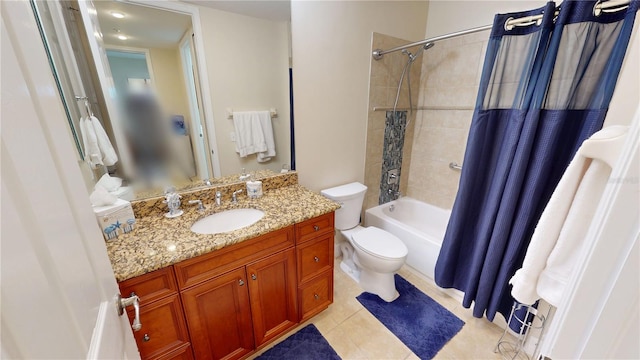 full bathroom with vanity, shower / tub combo, tile patterned floors, and toilet