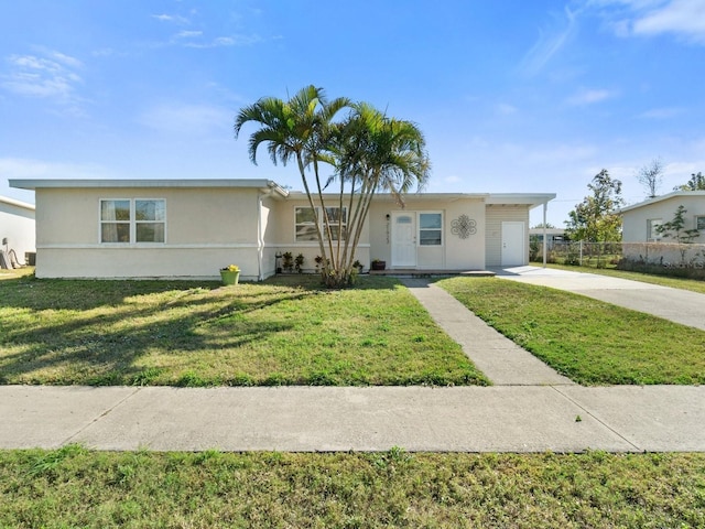 single story home featuring a garage and a front lawn