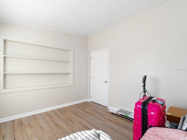 bedroom with light wood-type flooring