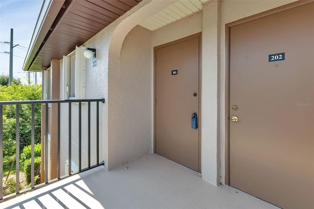 property entrance with a balcony