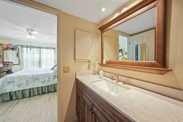 bathroom with vanity, wood-type flooring, and ceiling fan