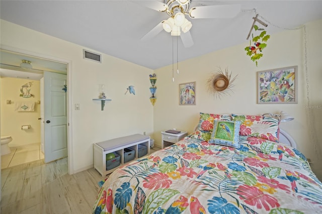 bedroom featuring connected bathroom, ceiling fan, and light wood-type flooring