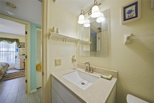 bathroom featuring vanity and hardwood / wood-style floors