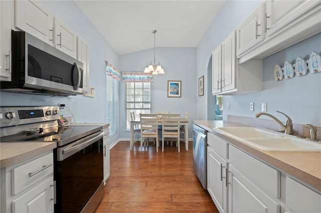 kitchen featuring white cabinetry, appliances with stainless steel finishes, and sink