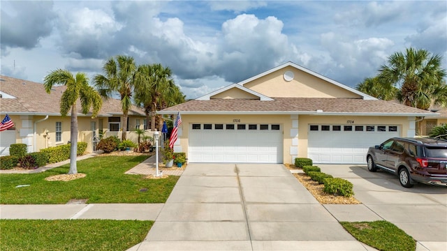 view of front facade with a garage and a front yard