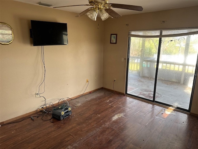 spare room with hardwood / wood-style floors and ceiling fan