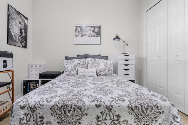 carpeted bedroom featuring a closet