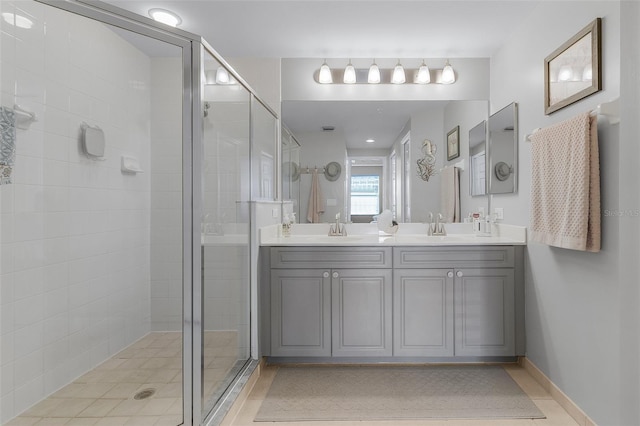 bathroom featuring vanity and a shower with shower door