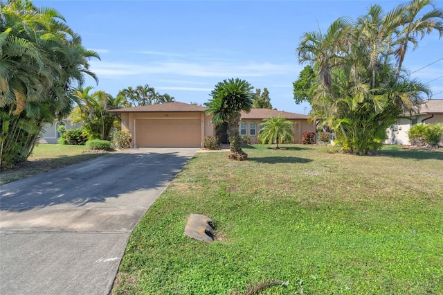 single story home with a garage and a front yard