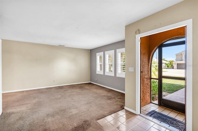 view of carpeted foyer