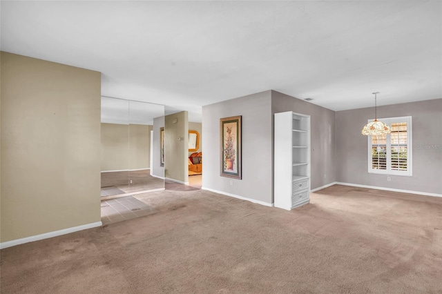 unfurnished room with carpet floors