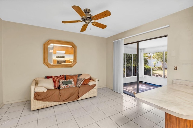 tiled living room with ceiling fan