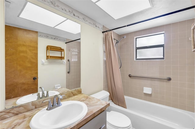 full bathroom featuring vanity, shower / bath combo, and toilet