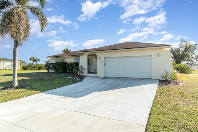 view of front of home with a front lawn and a garage