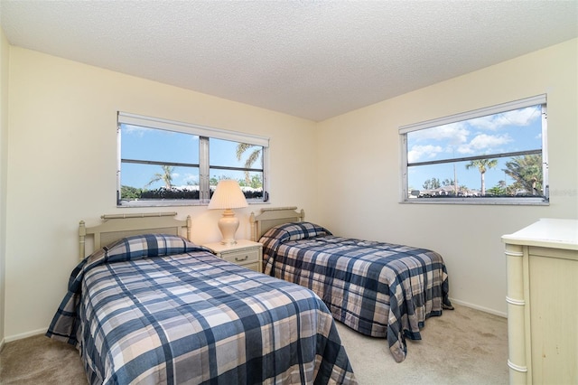 carpeted bedroom with a textured ceiling