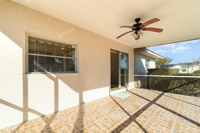 view of patio / terrace featuring ceiling fan