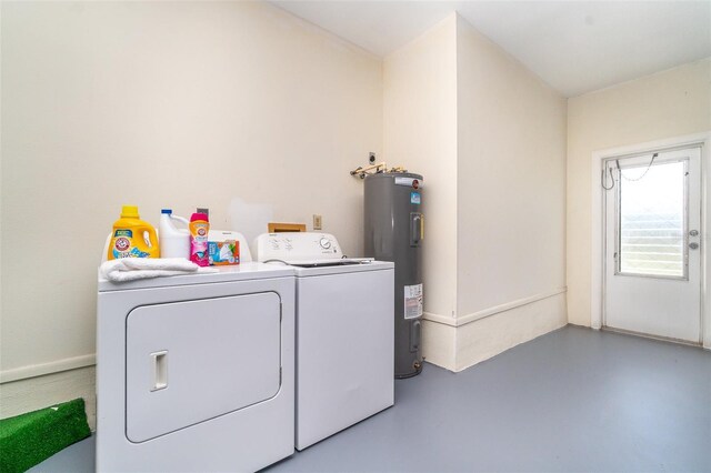 laundry room featuring electric water heater and washing machine and clothes dryer