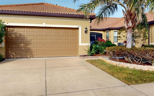 mediterranean / spanish house with a garage