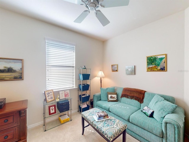 living room featuring ceiling fan and light carpet