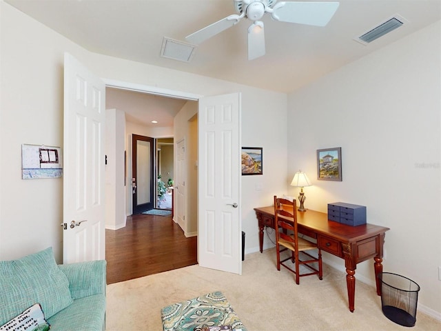 office area featuring ceiling fan and carpet floors