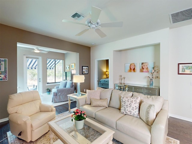 living room featuring ceiling fan and wood-type flooring