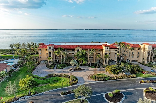 birds eye view of property with a water view