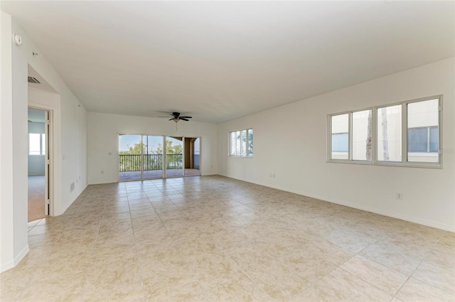 unfurnished room with ceiling fan