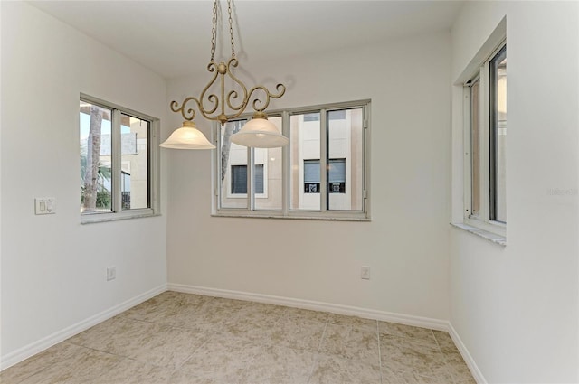 spare room featuring light tile patterned floors