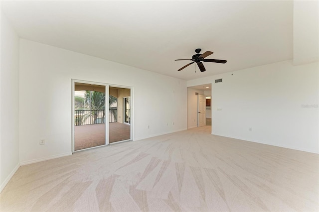 unfurnished room featuring ceiling fan and light colored carpet