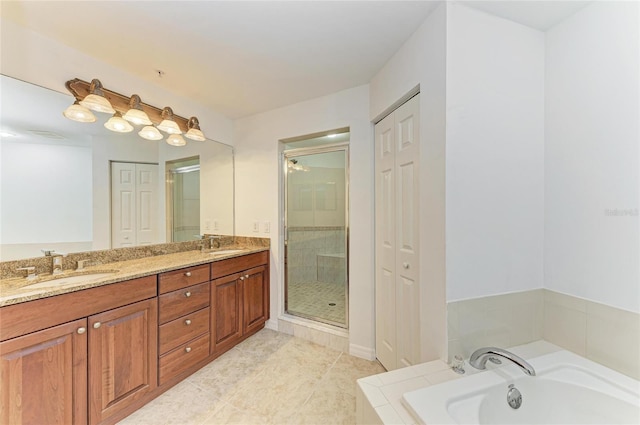 bathroom featuring vanity, tile patterned flooring, and plus walk in shower