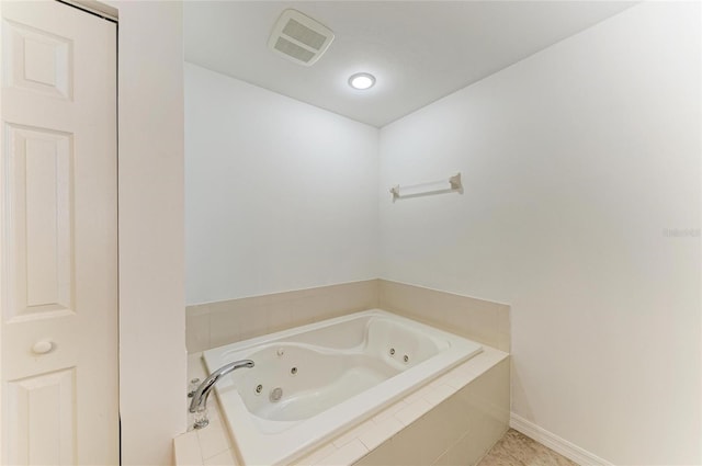 bathroom with tiled bath