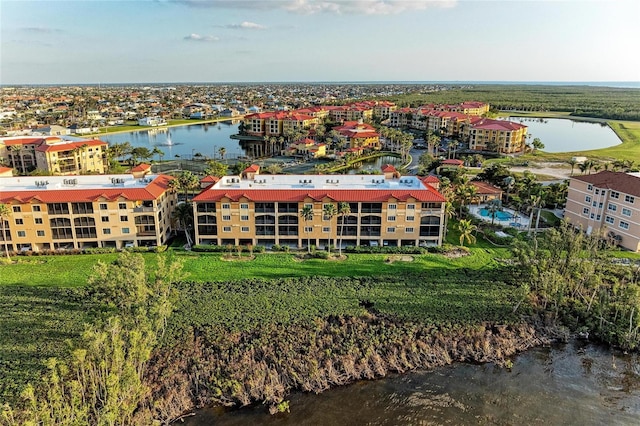 birds eye view of property featuring a water view