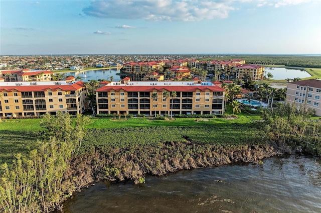 birds eye view of property with a water view