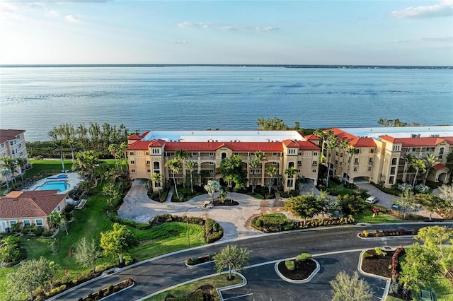 birds eye view of property with a water view