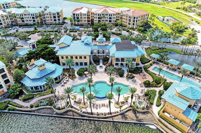 birds eye view of property with a water view