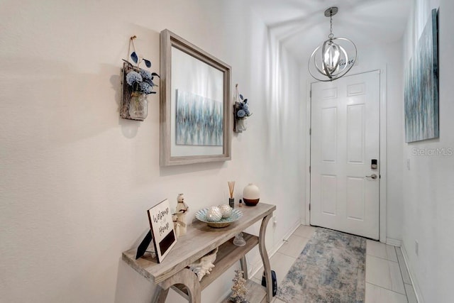 entryway featuring light tile patterned floors and an inviting chandelier