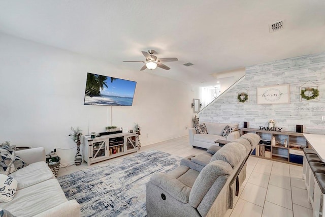 living room with light tile patterned floors and ceiling fan