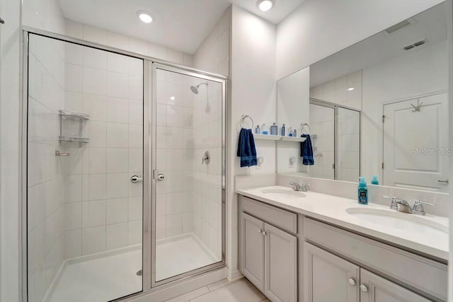 bathroom with vanity and walk in shower