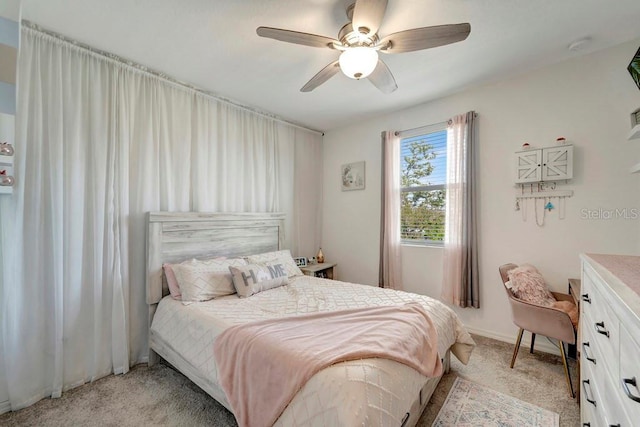 bedroom with light colored carpet and ceiling fan