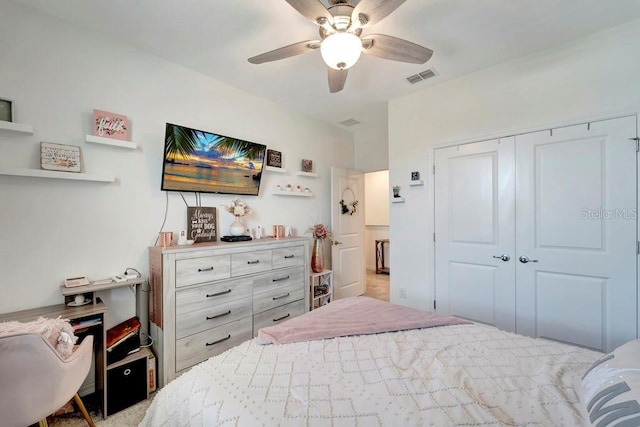 bedroom with ceiling fan and a closet