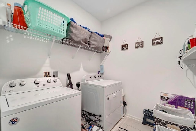 washroom with light tile patterned floors and independent washer and dryer