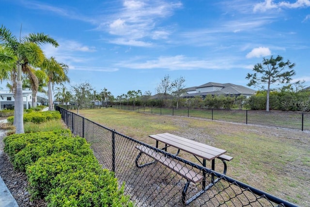 view of home's community with a yard