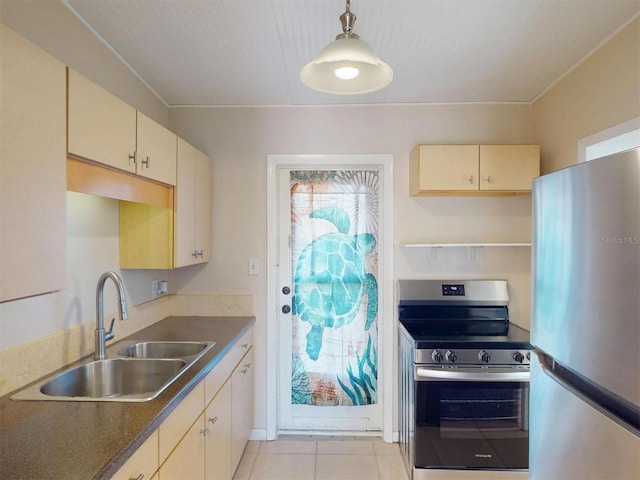 21456 Holdern Ave, Port Charlotte, FL 33952 - kitchen featuring sink, hanging light fixtures, cream cabinetry, and stainless steel appliances