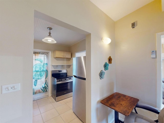 21456 Holdern Ave, Port Charlotte, FL 33952 - kitchen featuring white cabinets, hanging light fixtures, light tile patterned flooring, and stainless steel appliances