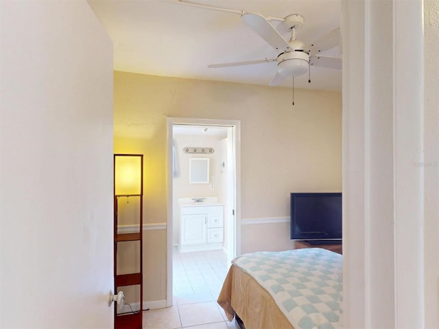 21456 Holdern Ave, Port Charlotte, FL 33952 - tiled bedroom featuring ceiling fan and ensuite bath