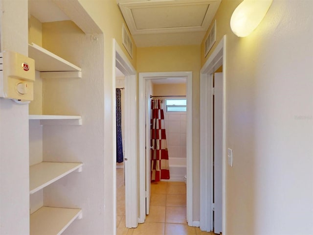 21456 Holdern Ave, Port Charlotte, FL 33952 - corridor featuring light tile patterned flooring